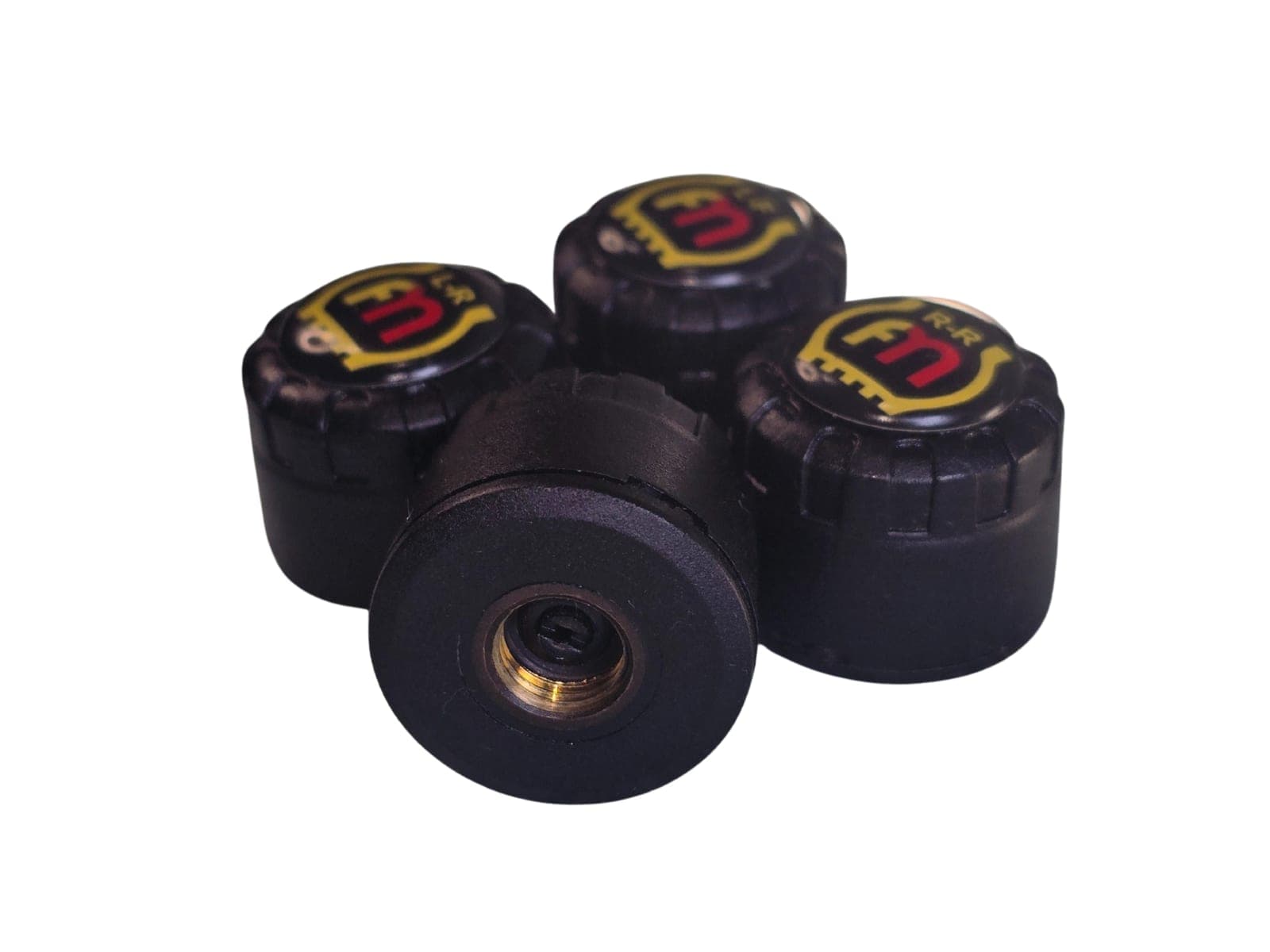 Four external sensors, one turned over to show its brass valve thread.
